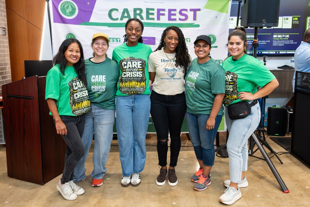 Care Fest team members gathered beneath the event banner