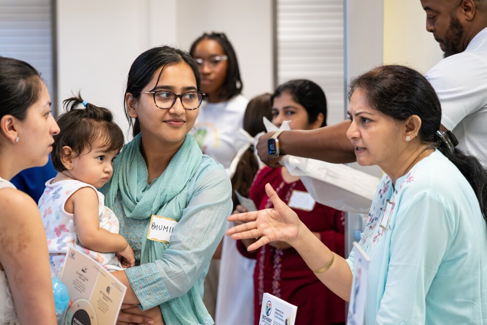 A family receiving support and information at Care Fest